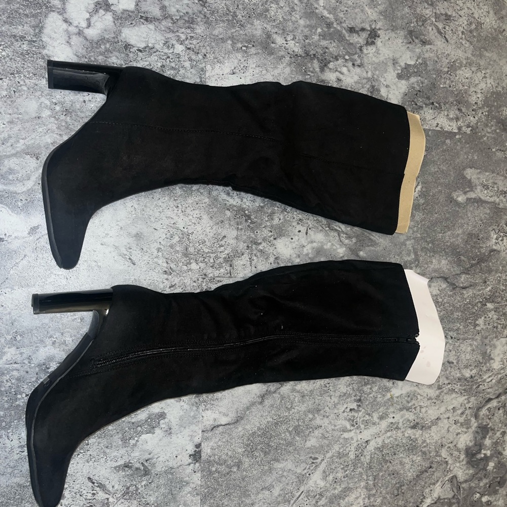 Never worn Black knee high heeled boots